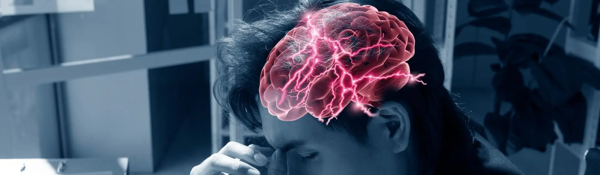 man holding his head.