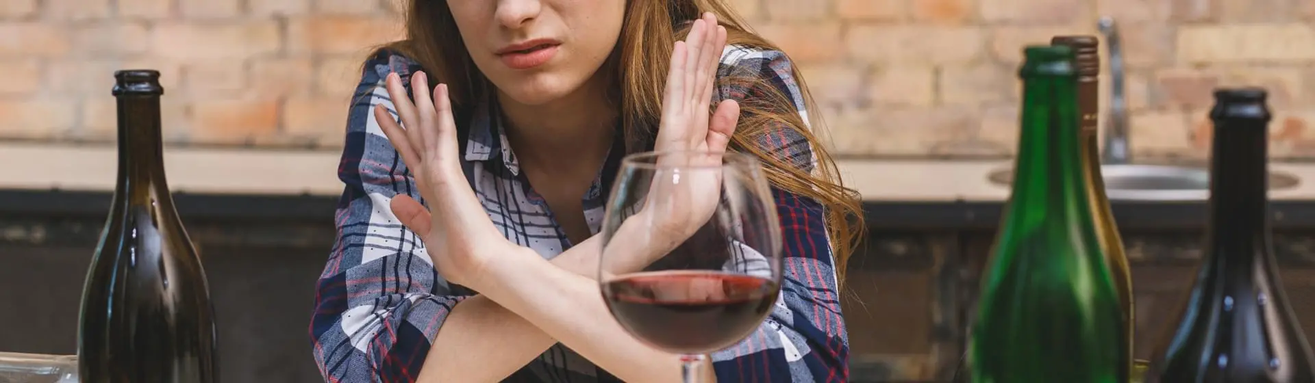 Woman saying no to alcohol.