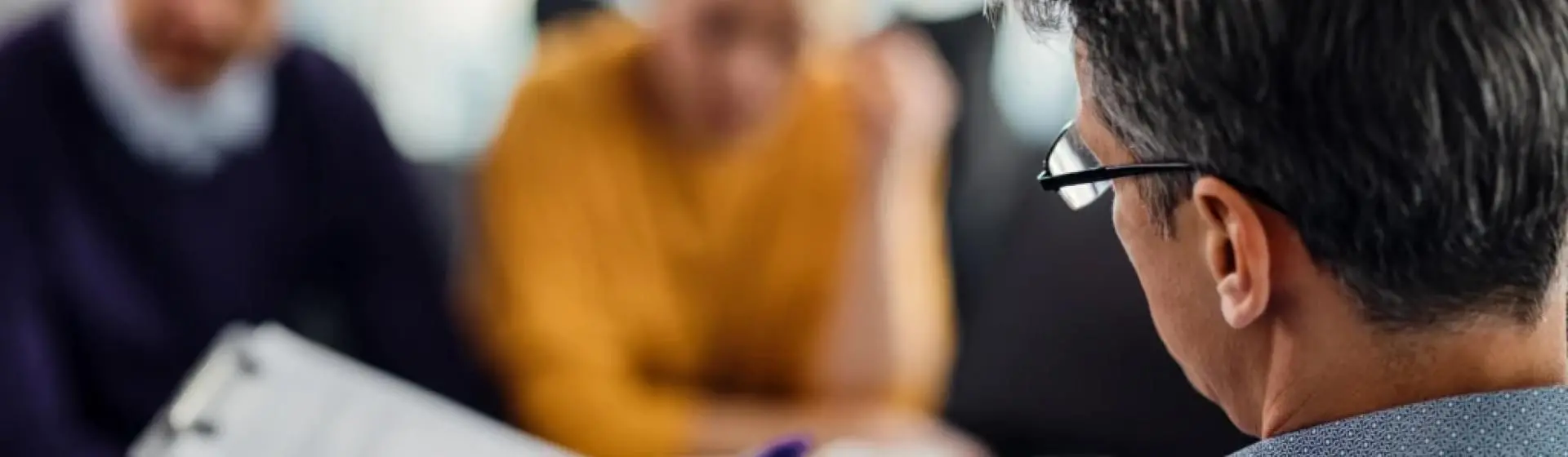 Couple speaking with therapist.